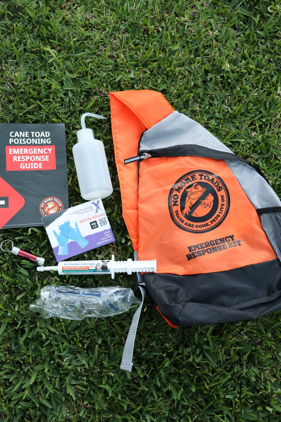 What's inside the Emergency Kit — activated charcoal, syringe, gloves, rinse bottle and guide
