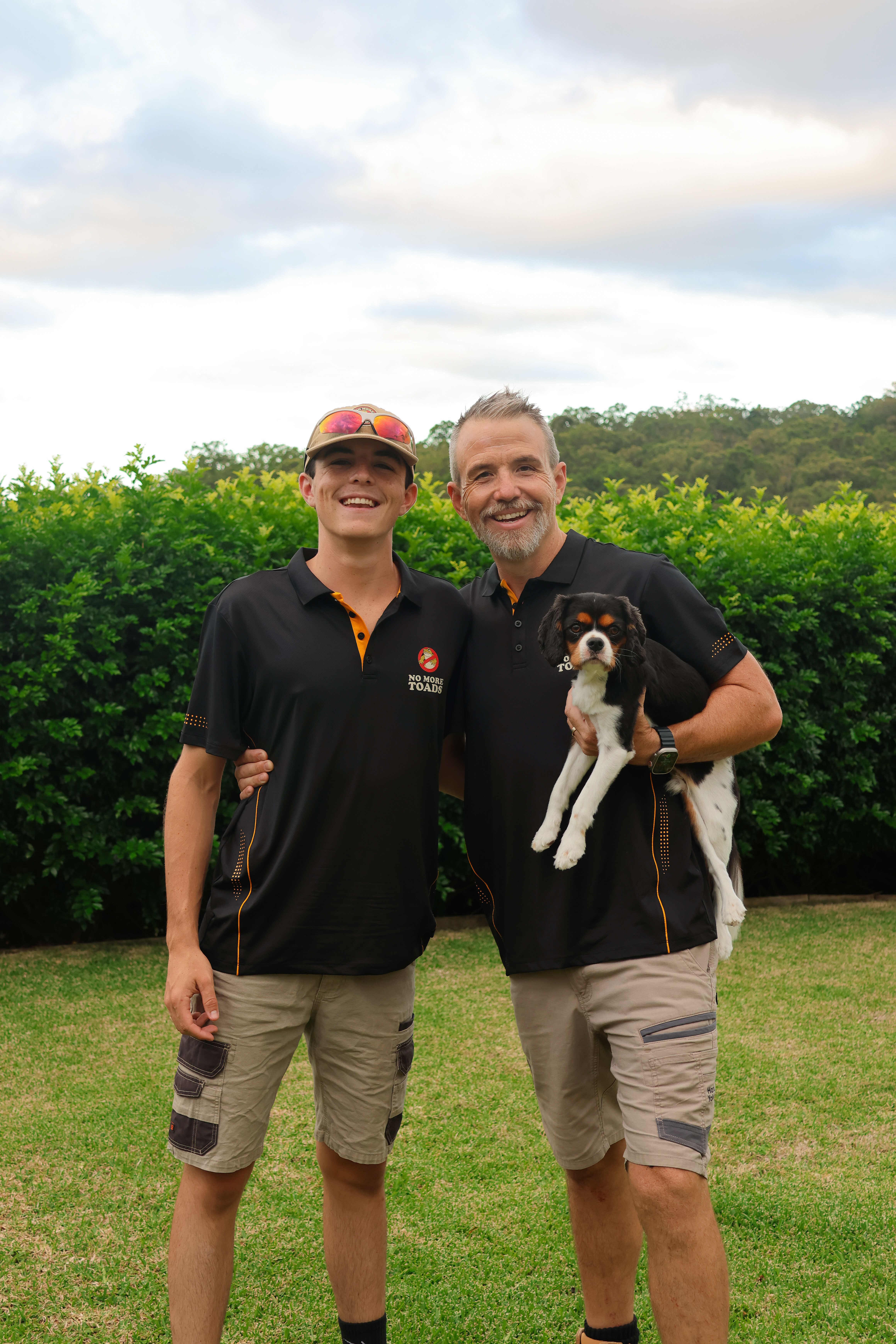 The No More Toads team — Matt and his son with their Cavalier King Charles Spaniel